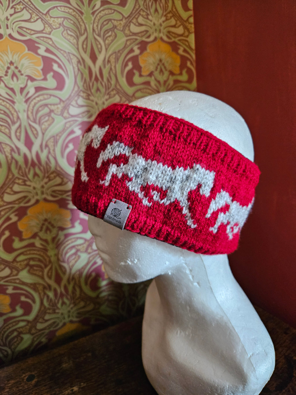 Earwarmer with horse design. Fully lined