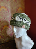 Earwarmer with sheep design in Olive. Fully lined.