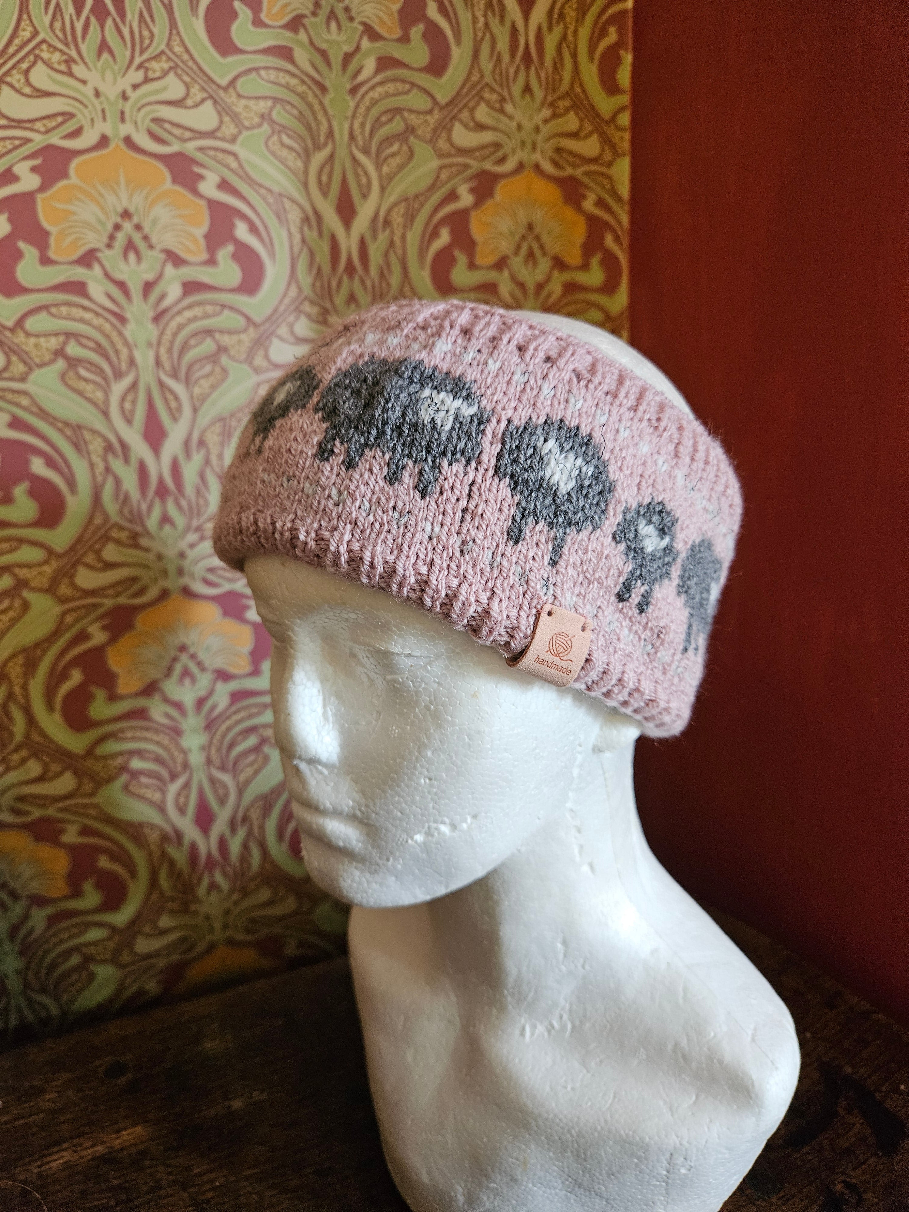 Earwarmer with sheep design. Fully lined