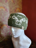 Earwarmer with cow design in olive green