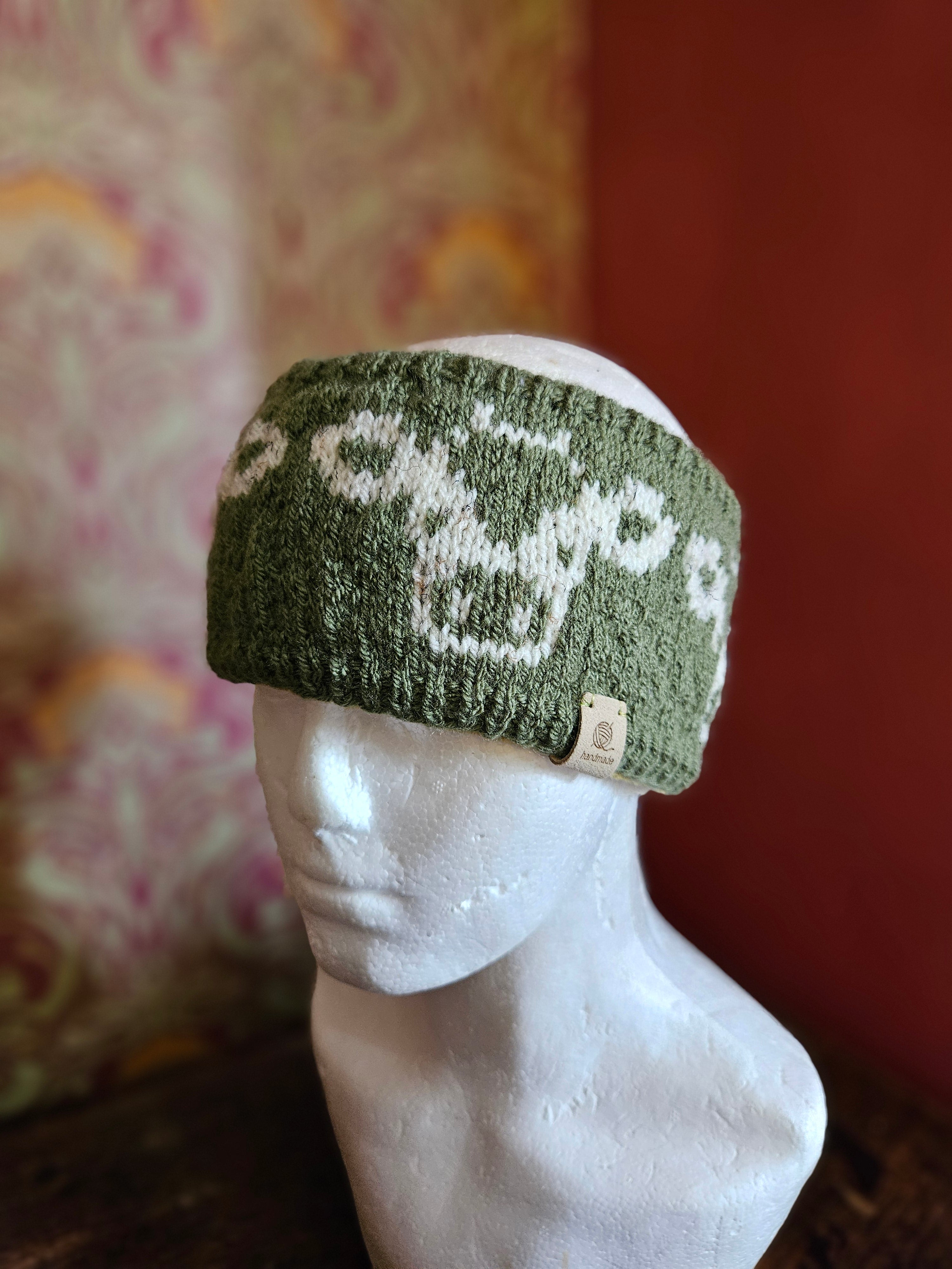 Earwarmer with cow design in olive green