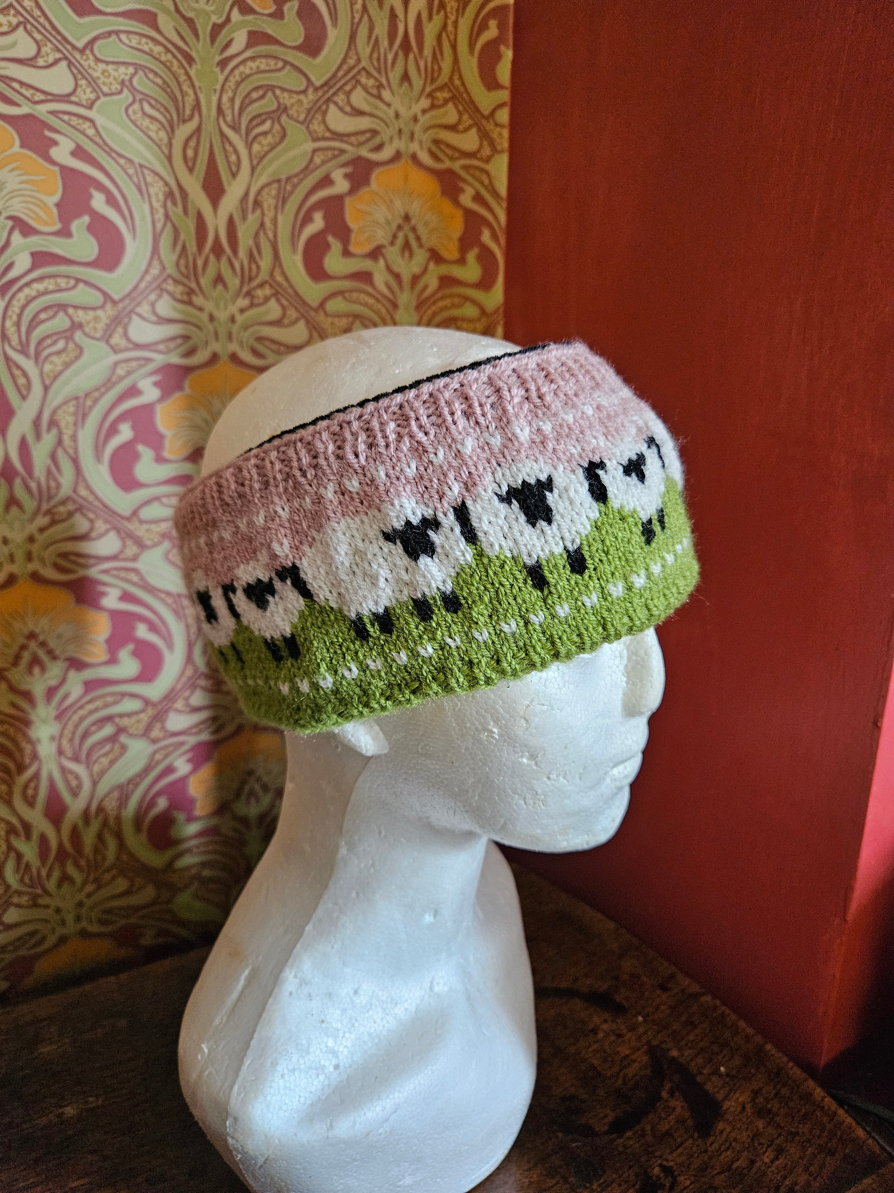Earwarmer with sheep design. Fully lined