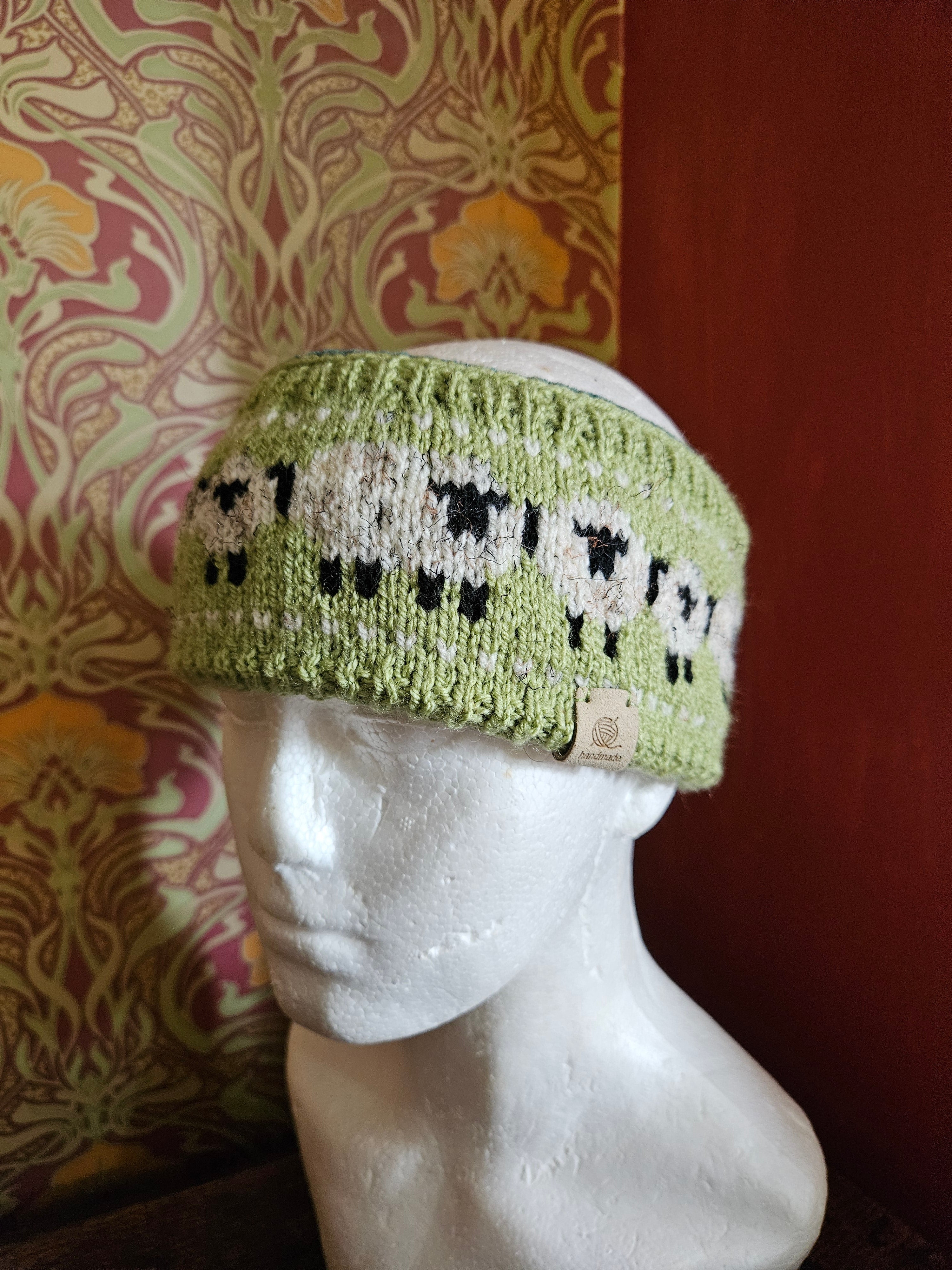 Earwarmer with sheep design. Fully lined