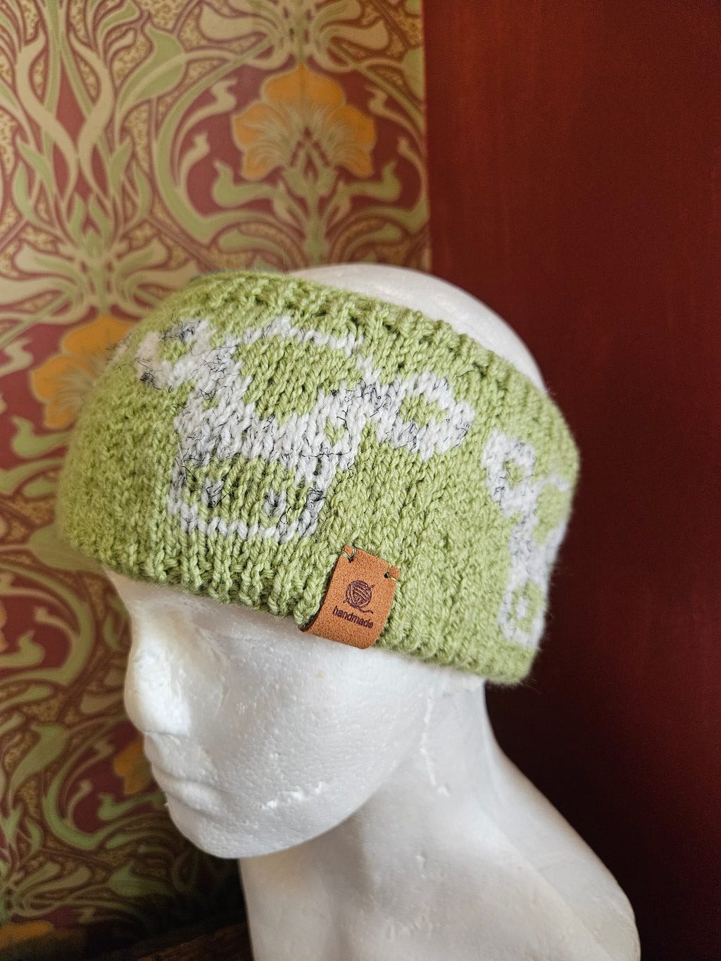 Earwarmer with cow design. Fully lined