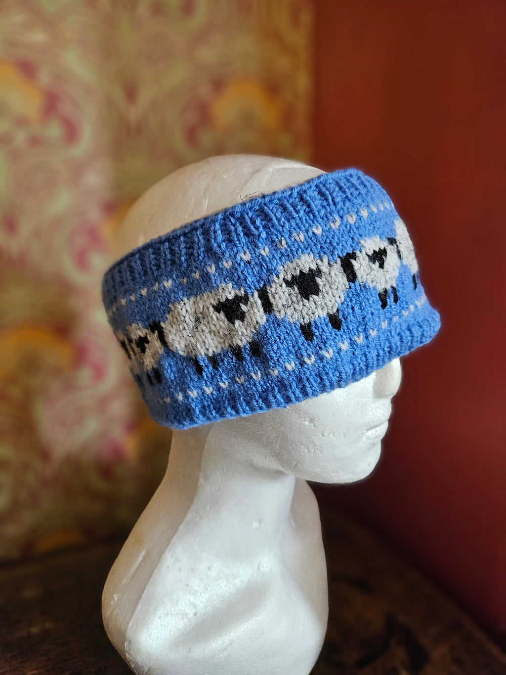 Earwarmer with sheep design in blue