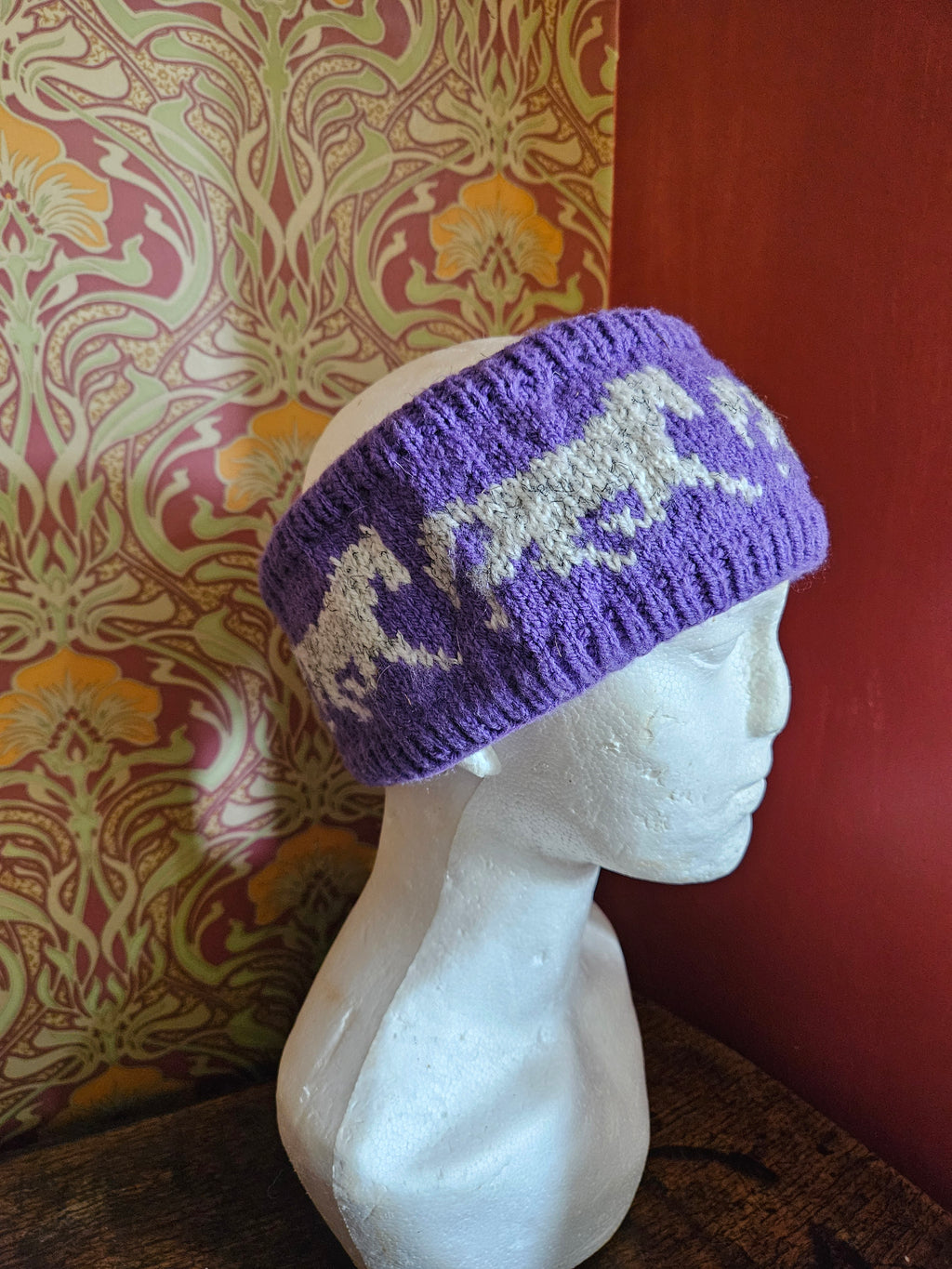 Earwarmer with horse design. Fully lined