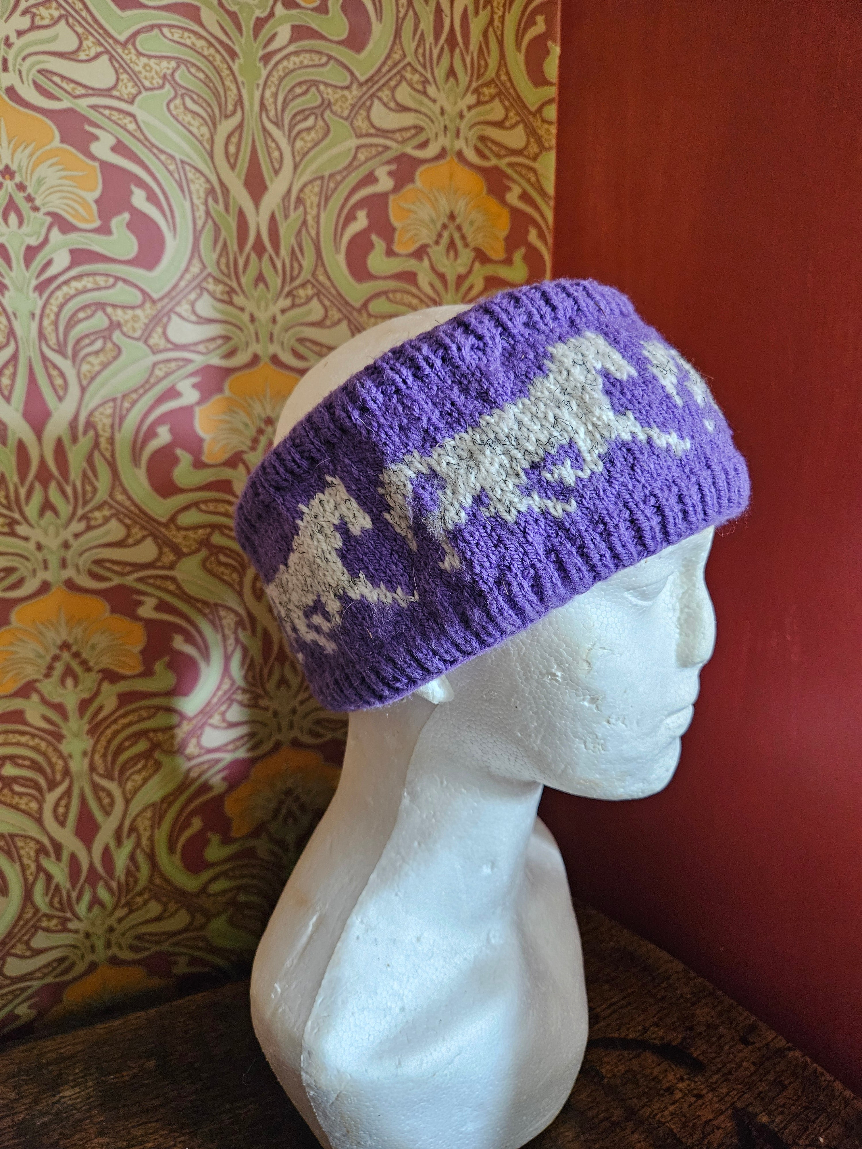 Earwarmer with horse design. Fully lined