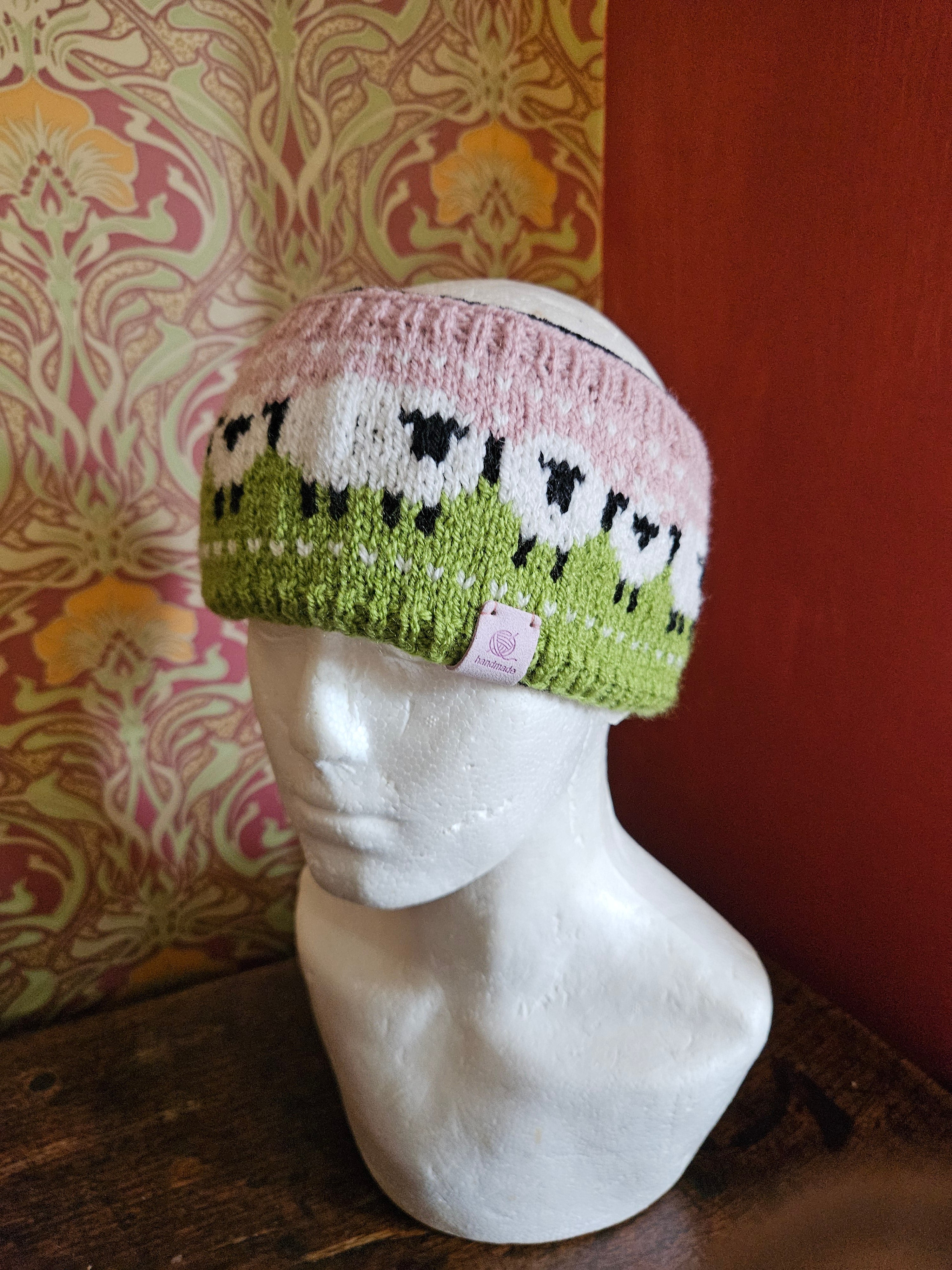 Earwarmer with sheep design. Fully lined