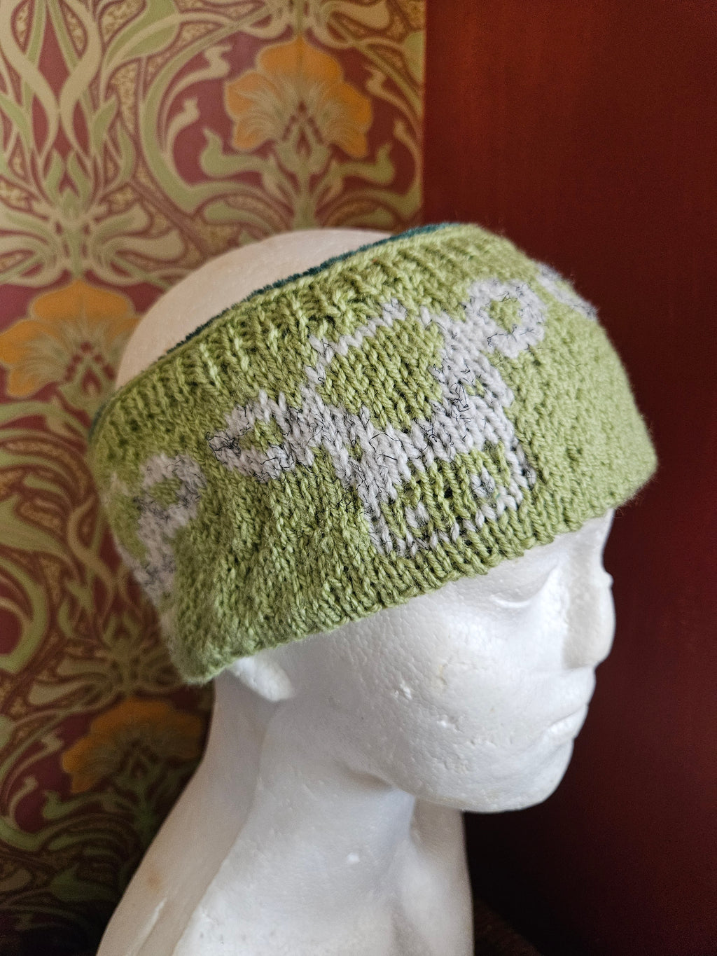 Earwarmer with cow design. Fully lined
