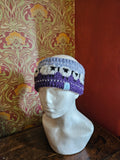 Sheep design earwarmer in plum and light blue