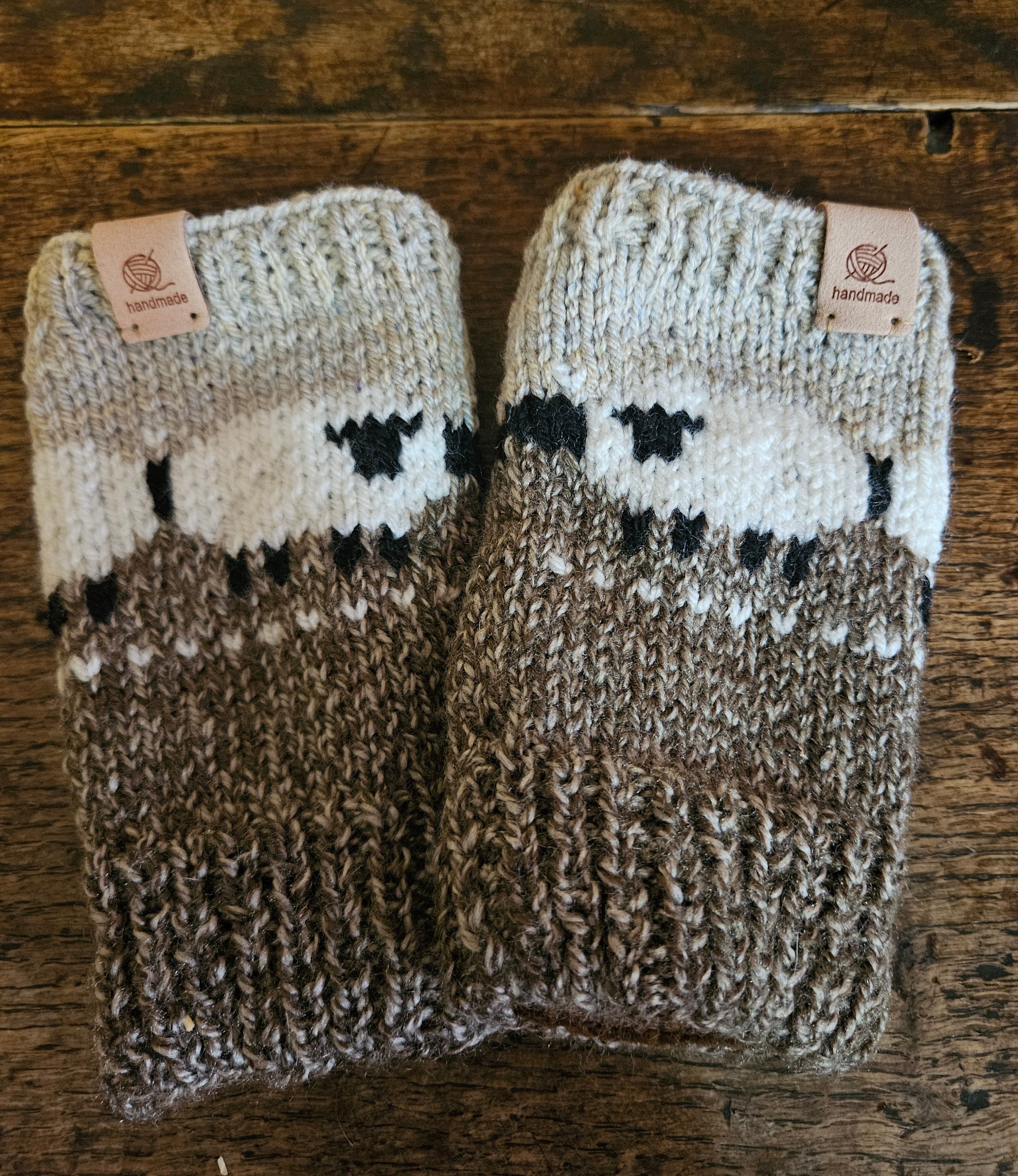 Wrist warmers with sheep design. Fully lined