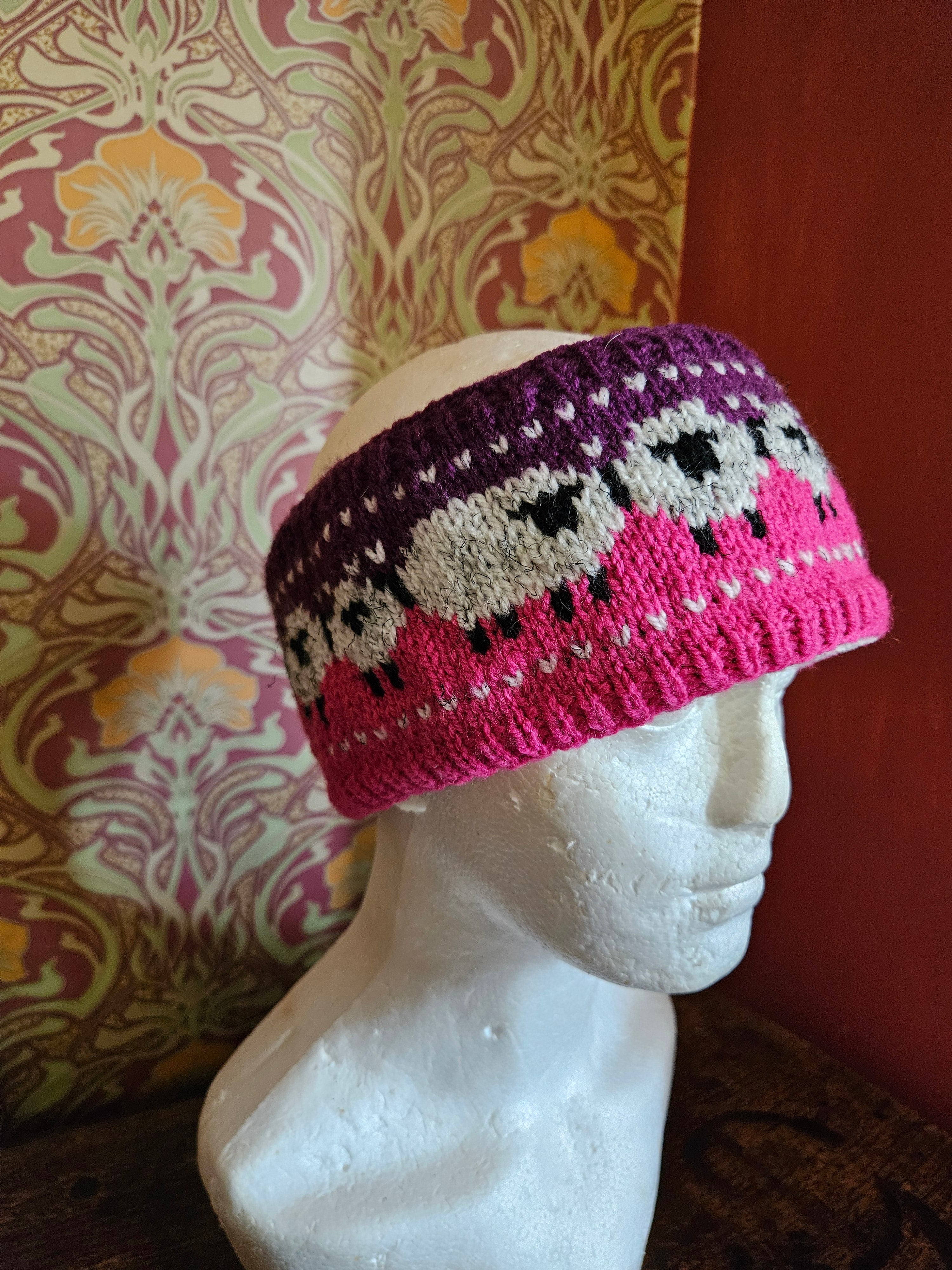 Earwarmer with sheep design. Fully lined