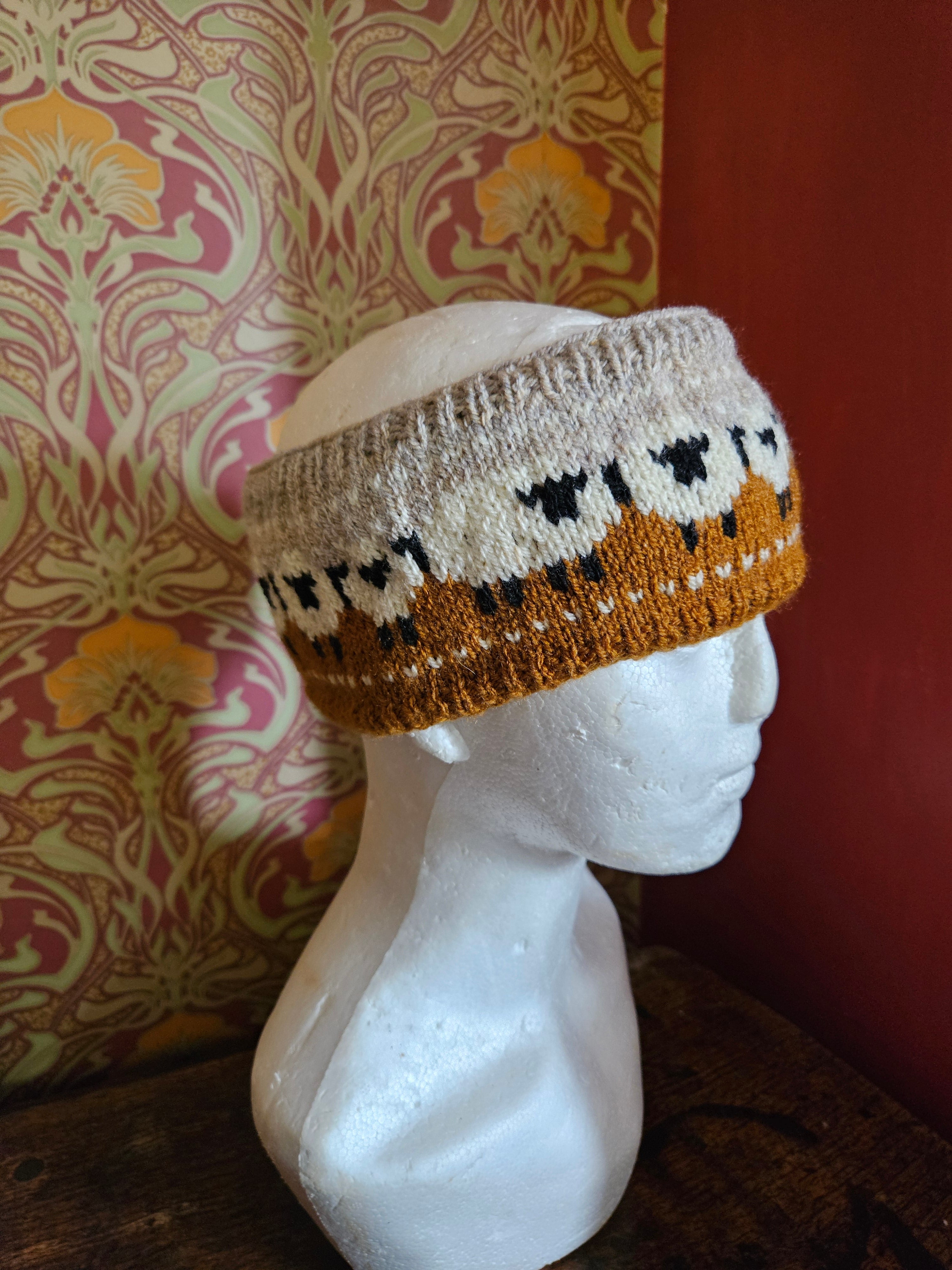 Earwarmer with sheep design. Fully lined