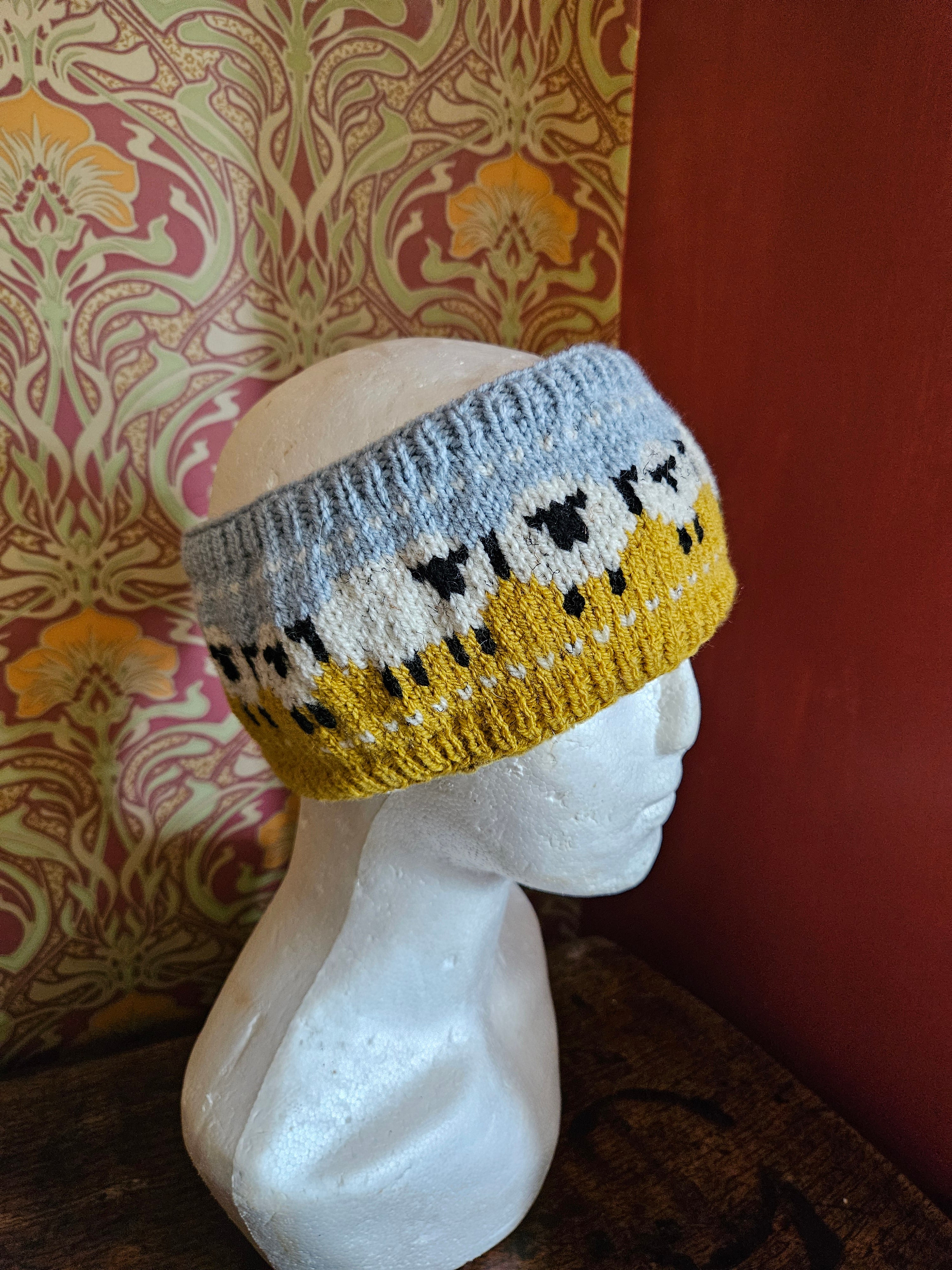 Earwarmer with sheep design. Fully lined