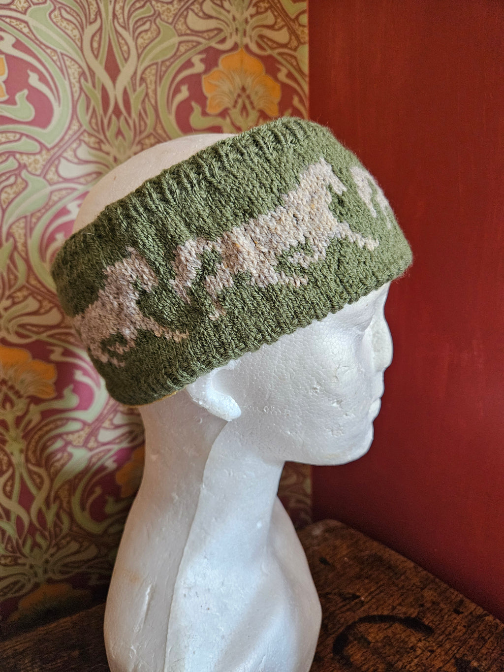 Earwarmer with horse design. Fully lined