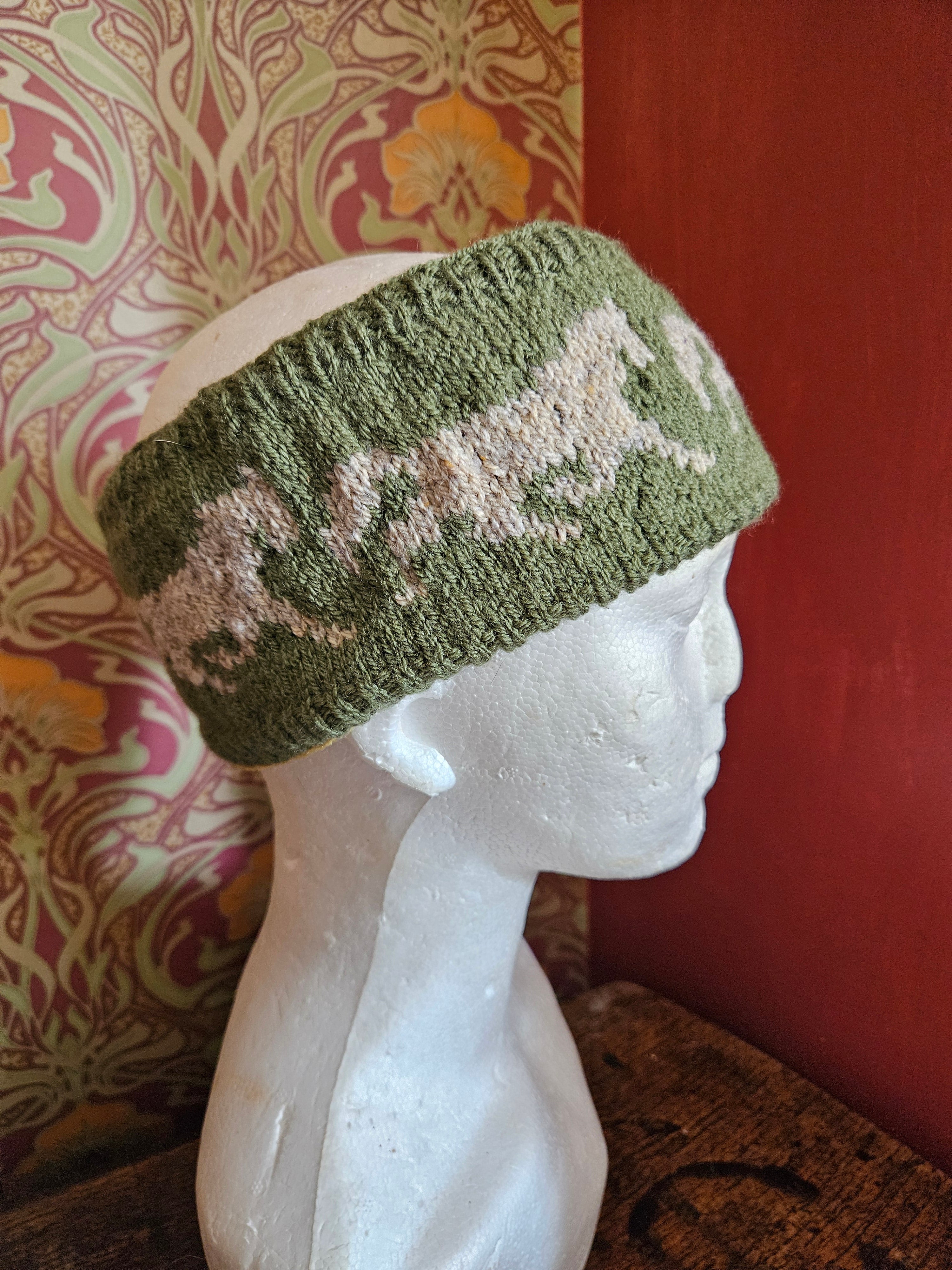 Earwarmer with horse design. Fully lined