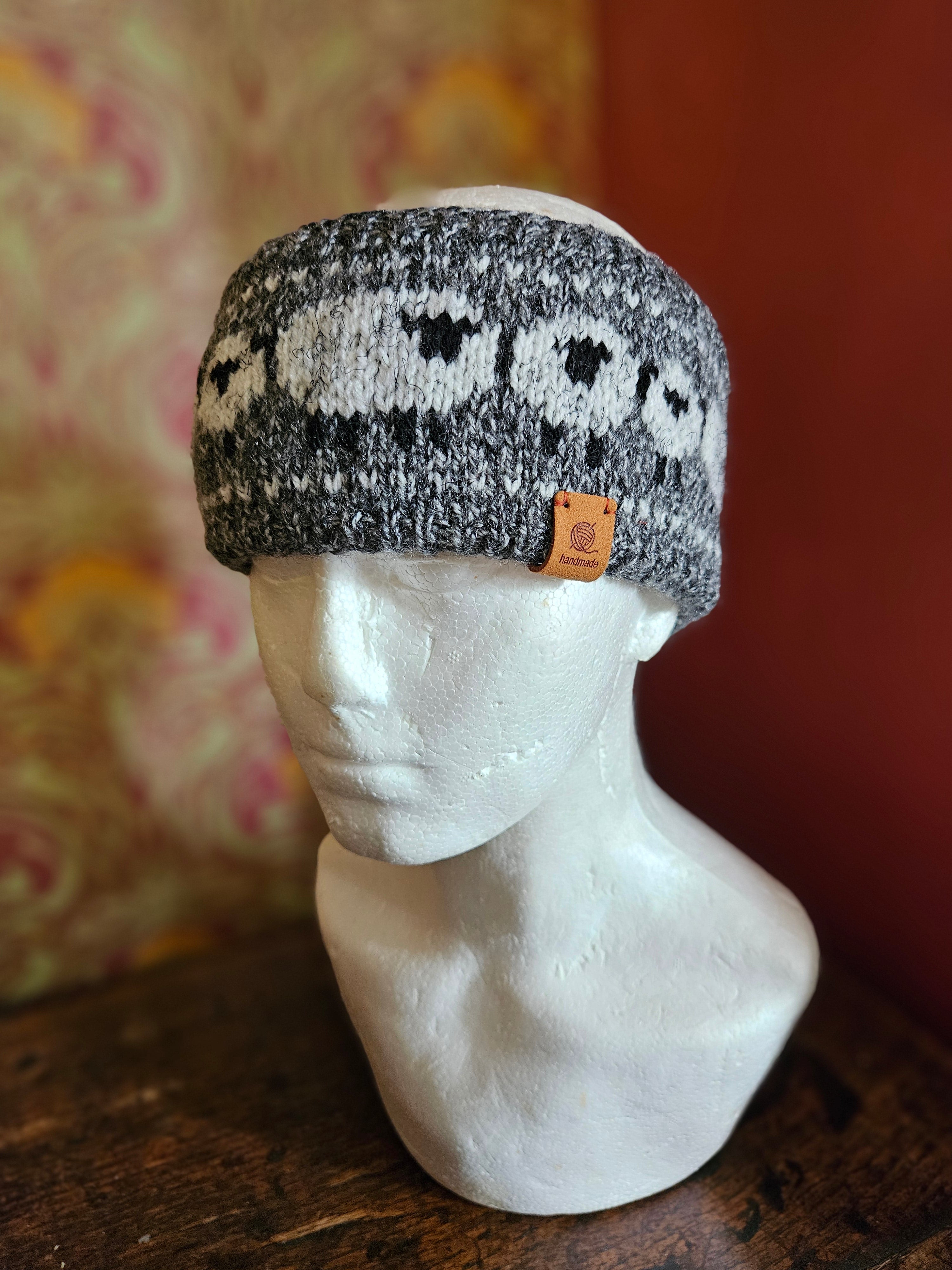 Earwarmer with sheep design. Fully lined