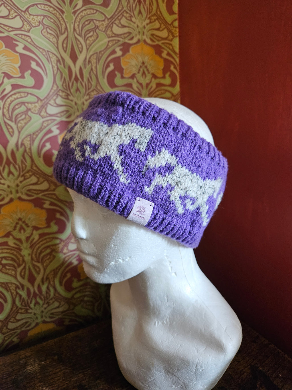 Earwarmer with horse design. Fully lined