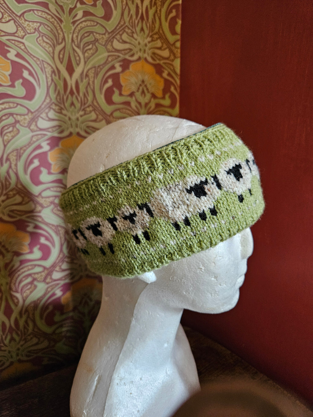 Earwarmer with sheep design. Fully lined