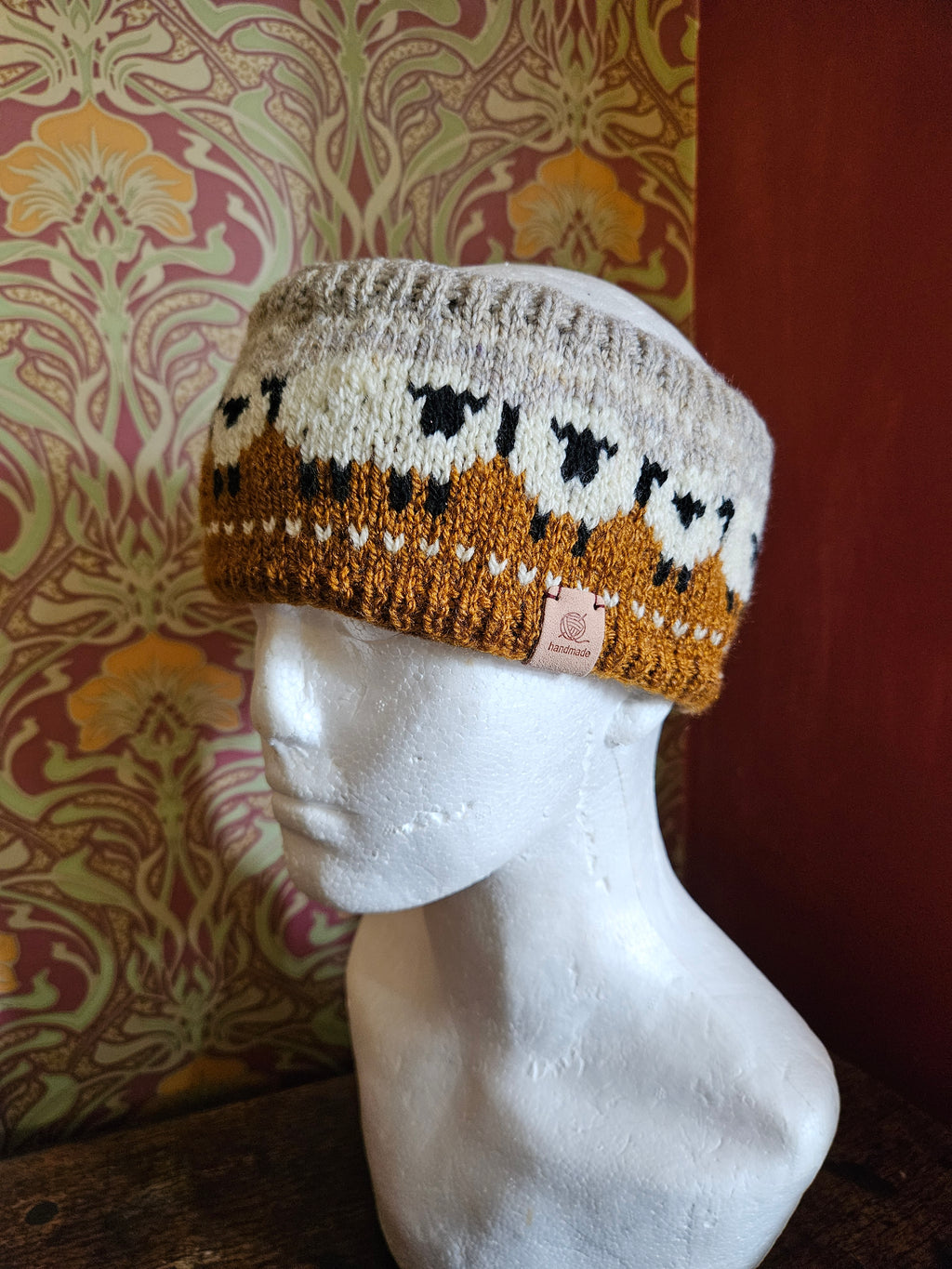 Earwarmer with sheep design. Fully lined