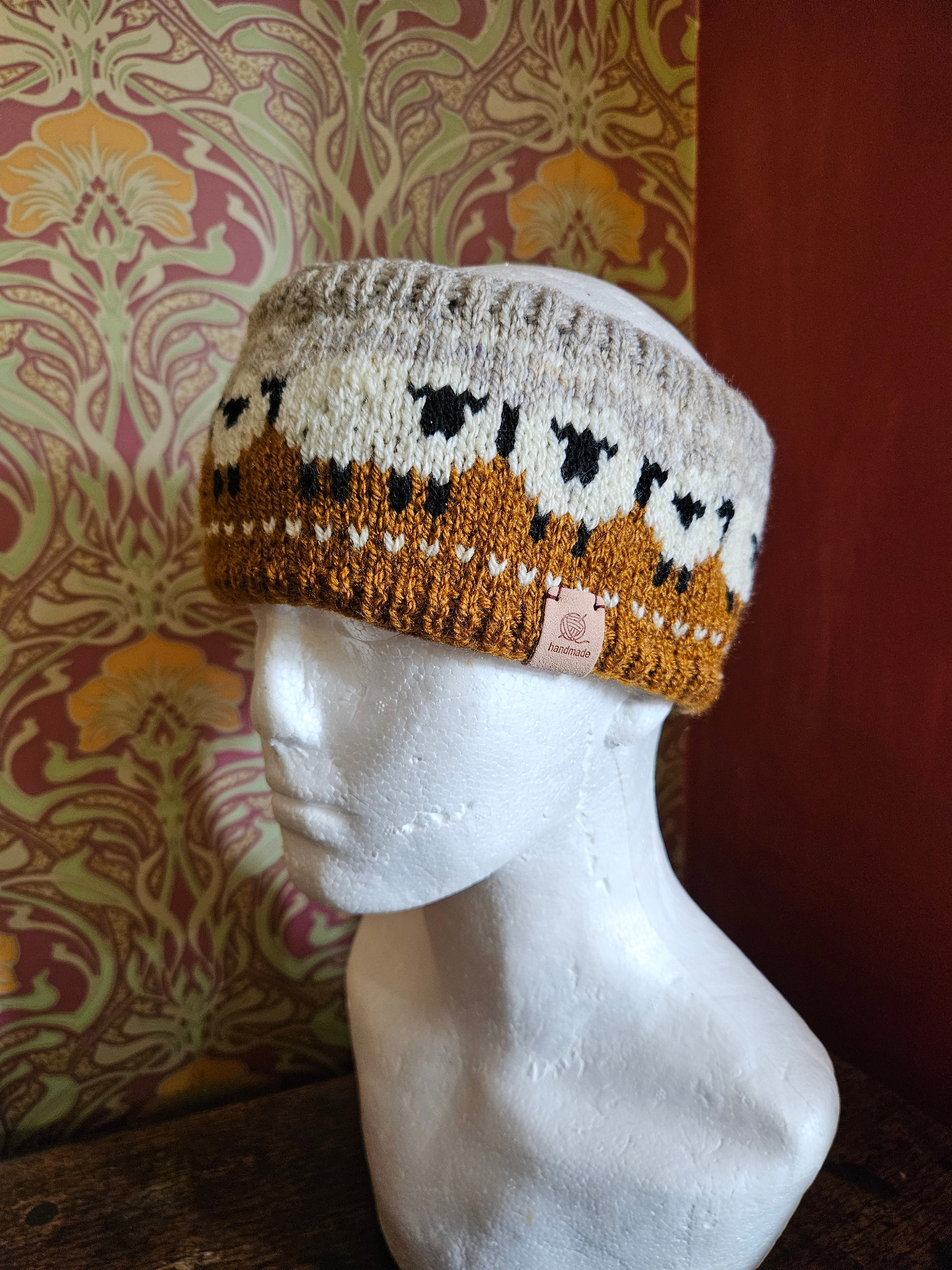 Earwarmer with sheep design. Fully lined