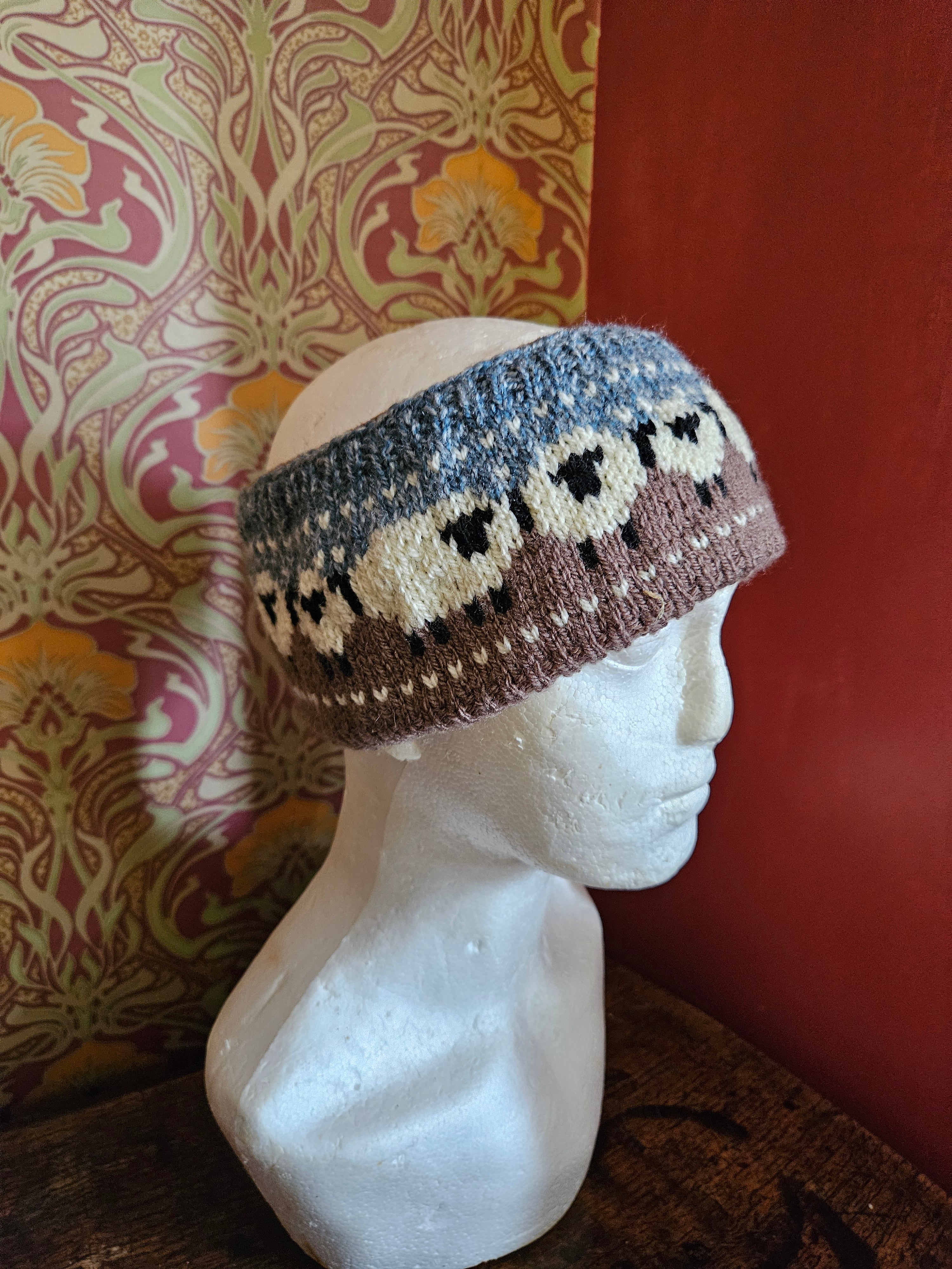 Earwarmer with sheep design. Fully lined